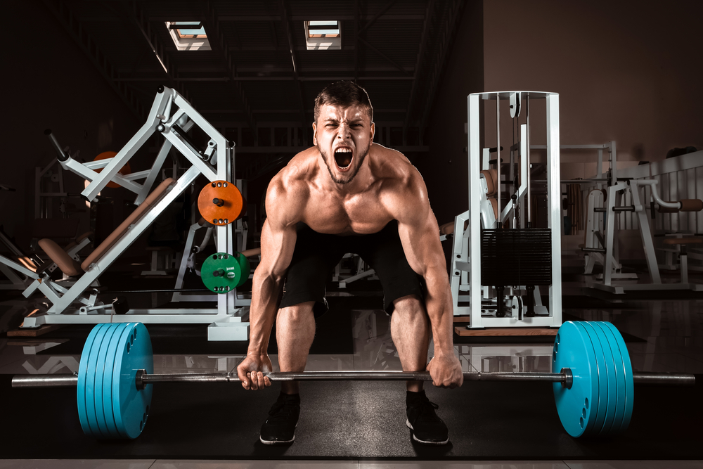 man shouting while deadlifting heaby weight