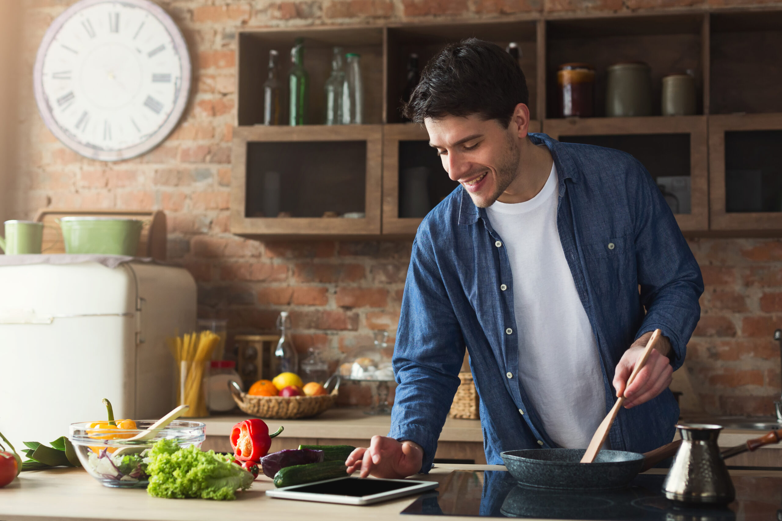 man cooking a meal in the kitchen